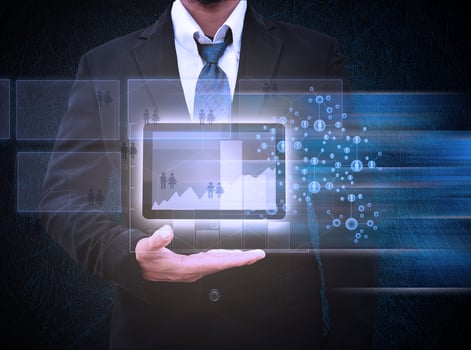 Business man hold Tablet computer and graph report photo
