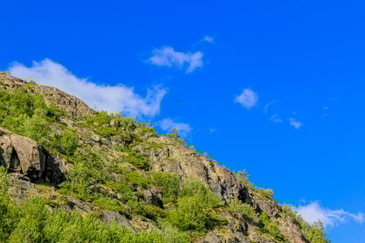 Clouds are flying above mountains in beautiful Hemsedal, Norway. photo