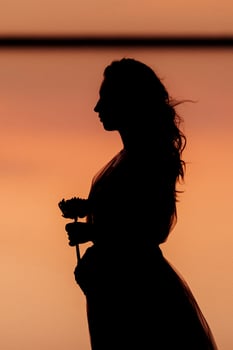 girl on the shore of a pink salt lake photo