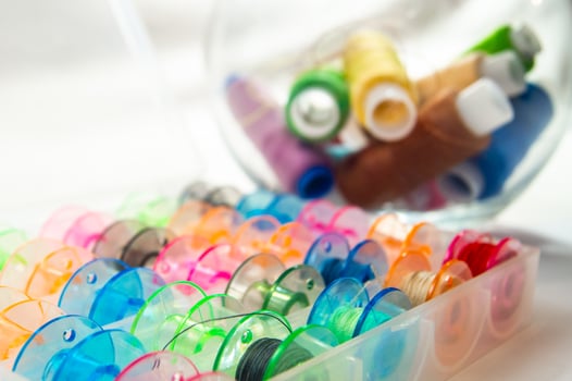 Bobbins with thread photo