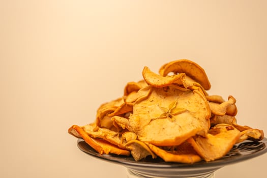 Dried apples cut into slices on a warm background. photo