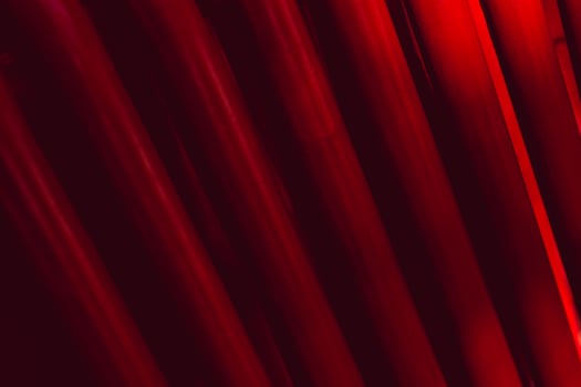 Abstract industrial background from pipes painted in red. photo