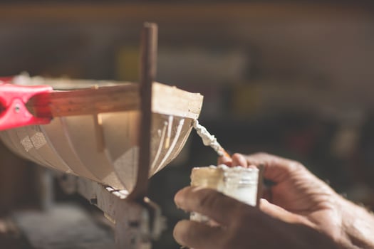 handcrafted craftwork of a wooden boat model photo