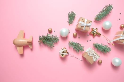 wooden children's plane on a pink background photo