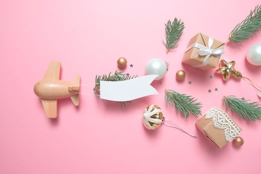 wooden children's plane on a pink background photo