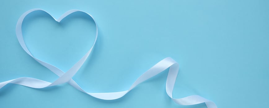 white ribbon in the shape of a heart photo