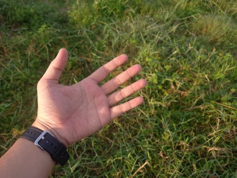 Man left hand showing five fingers photo