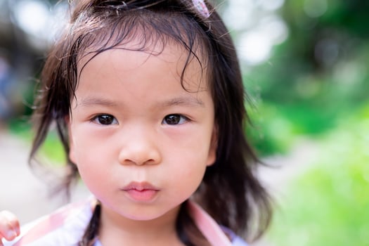Candid, a cute girl's face with hair drenched in sweat from the heat. In summer or spring. photo