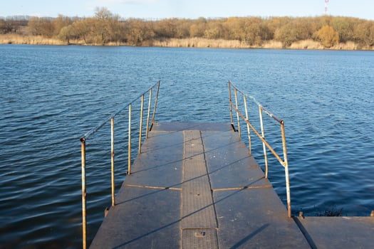 metal pier on the river photo