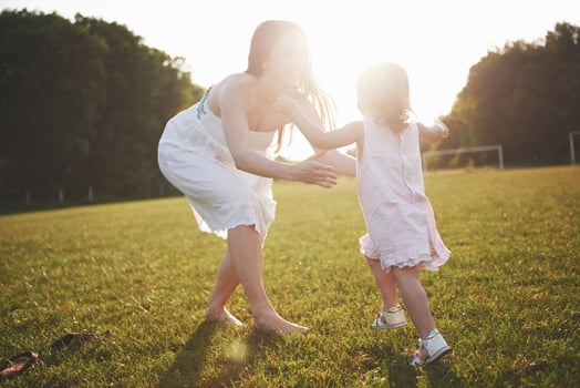 baby girl with mother on summer sunny day. photo