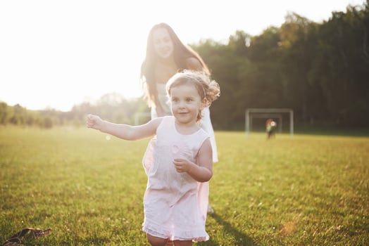 baby girl with mother on summer sunny day. photo