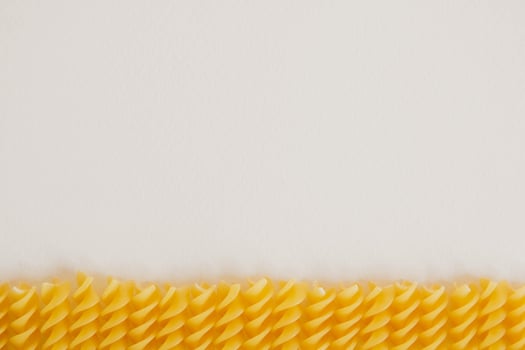 Spiral pasta on a white background photo