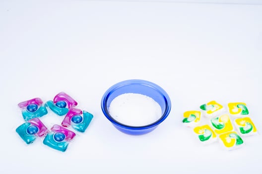 Various detergents for washing clothes, capsules and powder. Studio Photo. photo