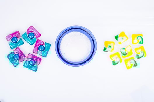 Various detergents for washing clothes, capsules and powder. Studio Photo. photo
