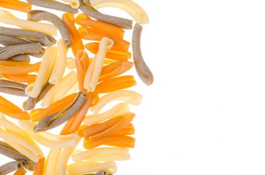 Pile of multi-colored pasta isolated on white background. photo