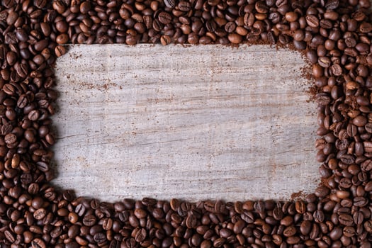 coffee beans background, in the middle wooden table photo