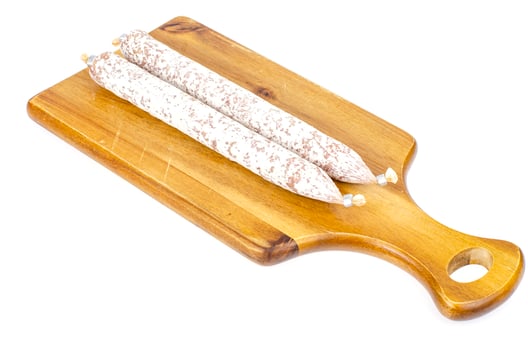 Dry-cured sausage in white mold casing. Photo