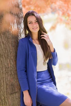 Young woman in autumn forest photo