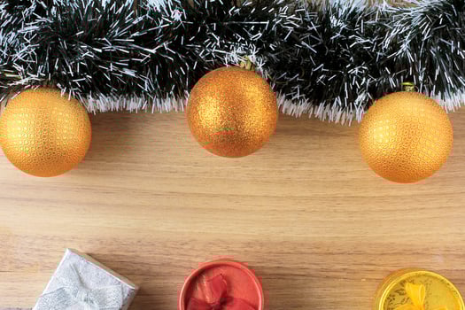 wooden background, christmas decoration with balls and gifts, decorative tree branches photo
