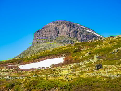 Amazing mountain peak at Veslehodn Veslehorn Hydnefossen waterfall Hemsedal Norway. photo