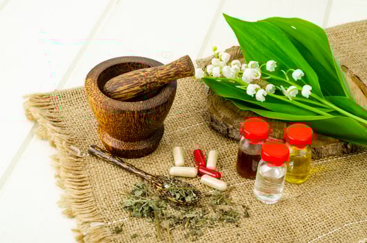 Lily of the valley, essential oil, extract, tincture, infusion, remedy, herbal capsules. Fresh flowers Convallaria majalis photo
