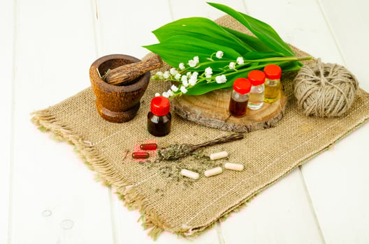 Lily of the valley, essential oil, extract, tincture, infusion, remedy, herbal capsules. Fresh flowers Convallaria majalis photo
