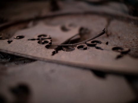abstract wooden pattern on rusty iron cover on the ground photo