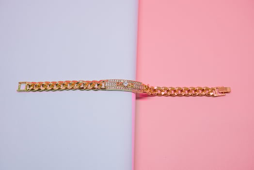 photo of women's square bracelet decorated with diamond gems
