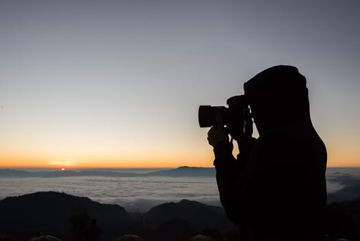 Morning Photographer Camping in the mountain background photo