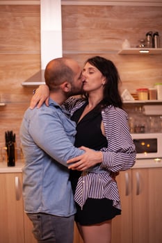Husband kissing wife photo