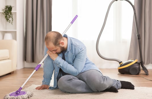 Exhausted husband on rug photo