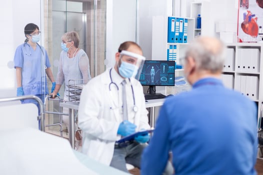 Nurse helping disabled old woman photo