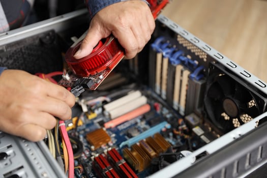 technician man fix or upgrading VGA card on computer photo