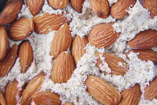 almond powder and almond in a jar on table, photo
