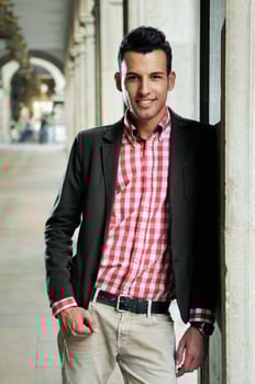 Handsome man wearing jacket and shirt in urban background photo