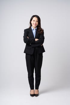 full body image of beautiful young asian businesswoman, isolated on white background photo