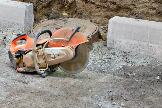 Concrete cutter at the construction site in working order. photo