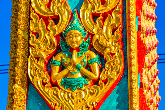 Praying buddha Wat Phadung Tham Phothi temple Khao Lak Thailand. photo
