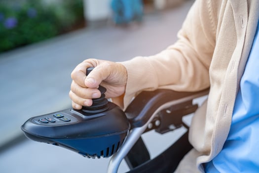 Asian senior or elderly old lady woman patient on electric wheelchair with remote control at nursing hospital ward, healthy strong medical concept photo