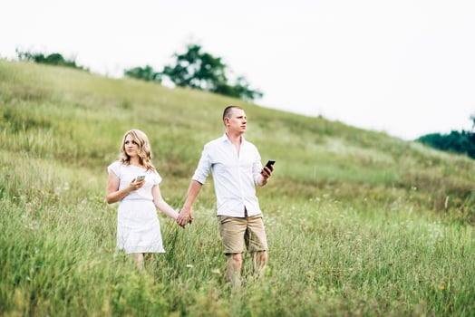 a guy with a girl in light clothes on the background of a green canyon photo