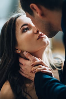 girl and guy cuddle each other photo