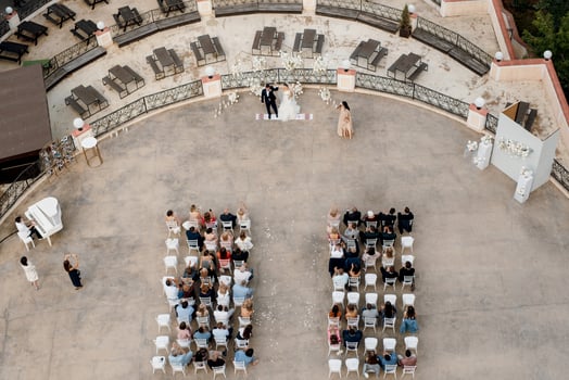 City, Country, MMM DD, YYYY - Aerial view of a wedding ceremony photo