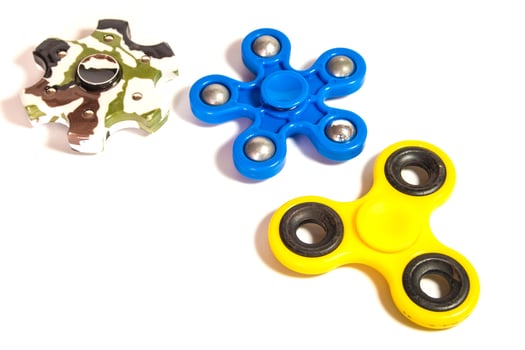 Hand spinner spinning on white background photo