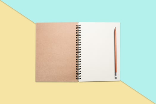 Notebook and pen on  colore background photo