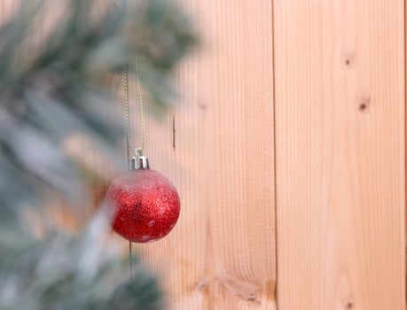 christmas tree background with decorations on wooden board.selective focus at ball photo
