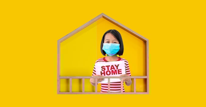 A girl wearing a mask in a model house holding a stay home campaign, Covid-19 concept. photo