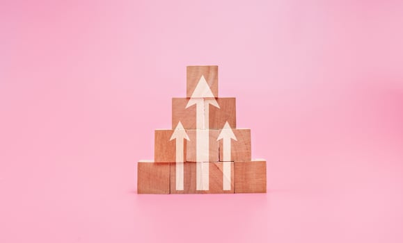 Growth graph and arrows ladder career path for business growth success process concept, Up arrow on wooden block photo