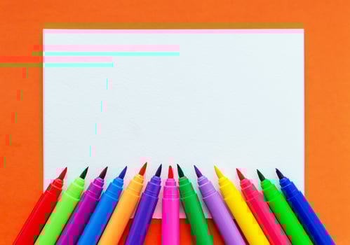 Template. Felt pens on a sheet with a place for inscription. View from above. photo