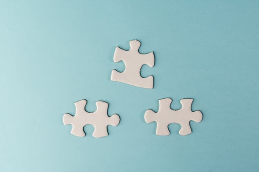 Pieces of white jigsaw puzzle photo