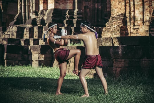 Two boxers fight with the martial arts of Muay Thai. photo